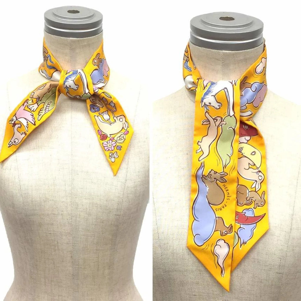Pre-Owned HERMES Twilly Scarf Muffler Thousand and One Rabbits Mille et Un Lapins 2023 H064007S 04 Bouton D’or/Parm/Beige 100% Silk Hermes (Like New)